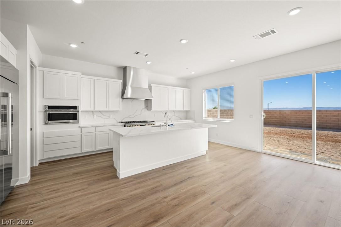Image 4: A pristine culinary space with an expansive kitche