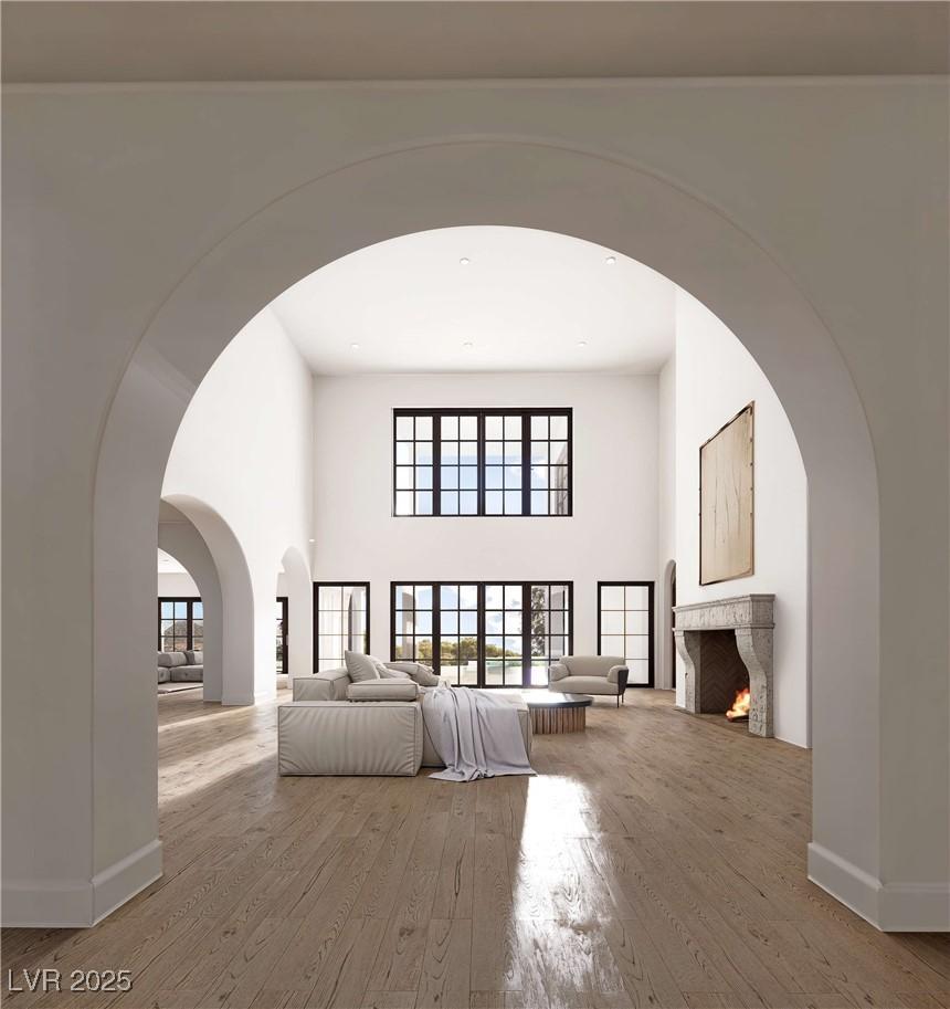 Image 3: Unfurnished living room with hardwood / wood-style
