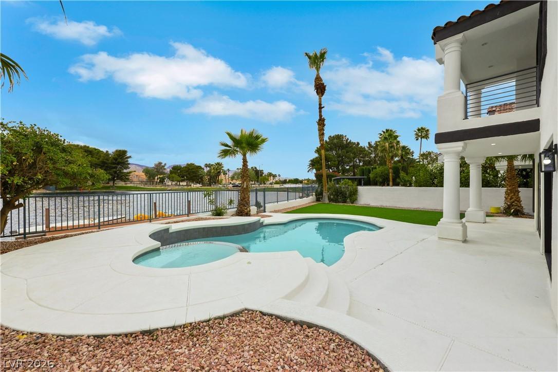 Image 4: A tranquil lakefront setting featuring a refreshin
