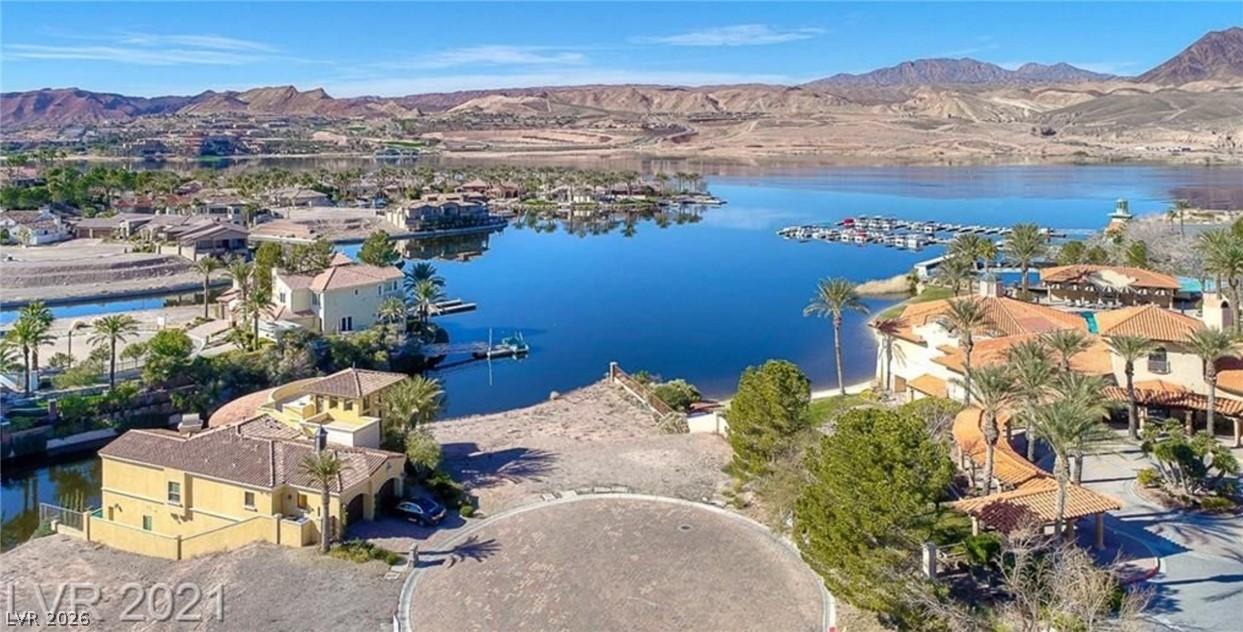 Image 3: Aerial view of residential area with a water and m
