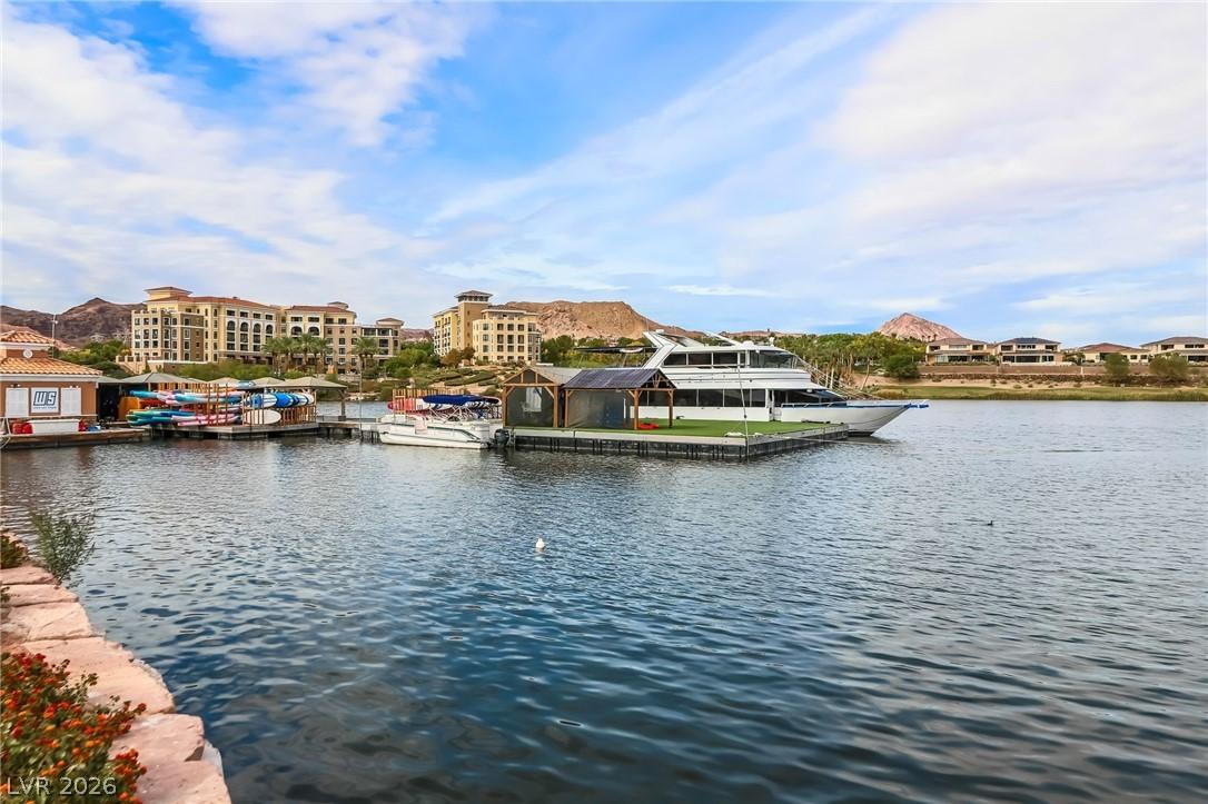 Image 3: This tranquil waterfront scene features a boat doc