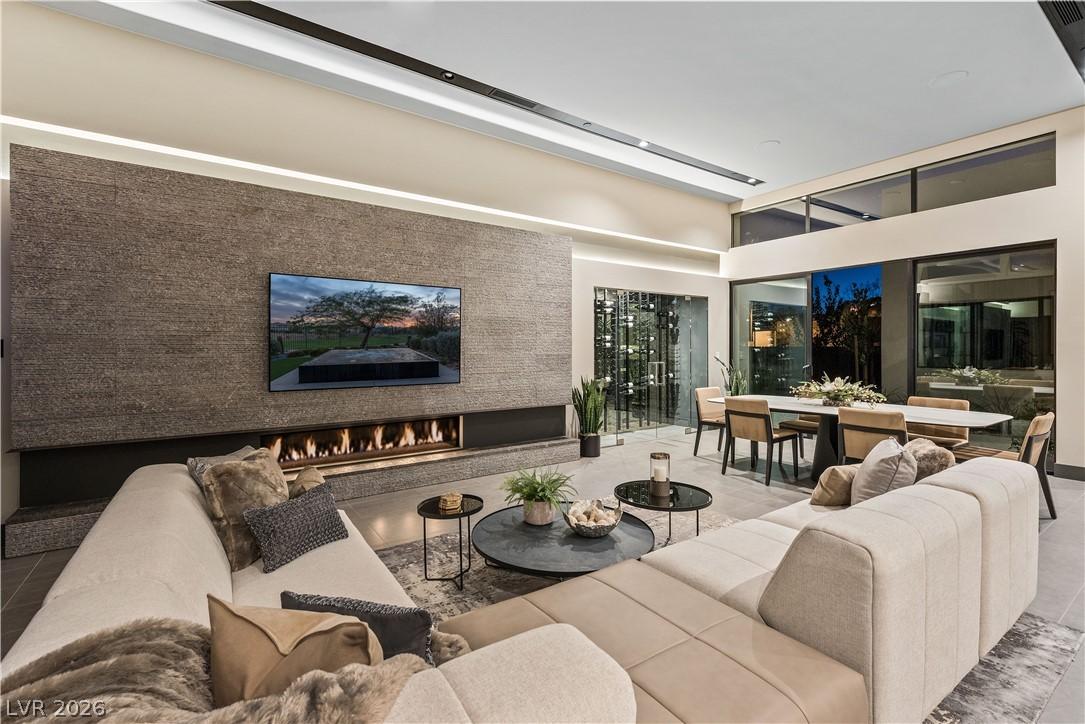 Image 2: A refined living space showcases a sleek linear fi