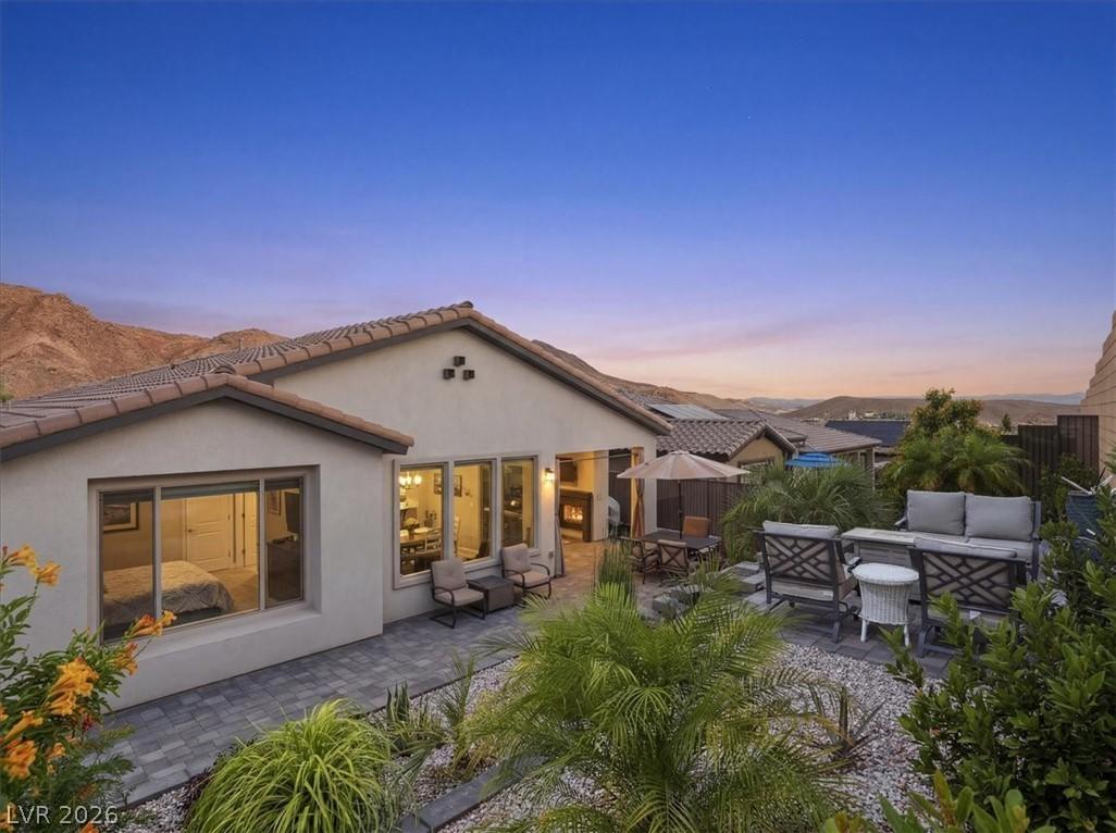 Image 3: A private outdoor space with a fire pit and divers