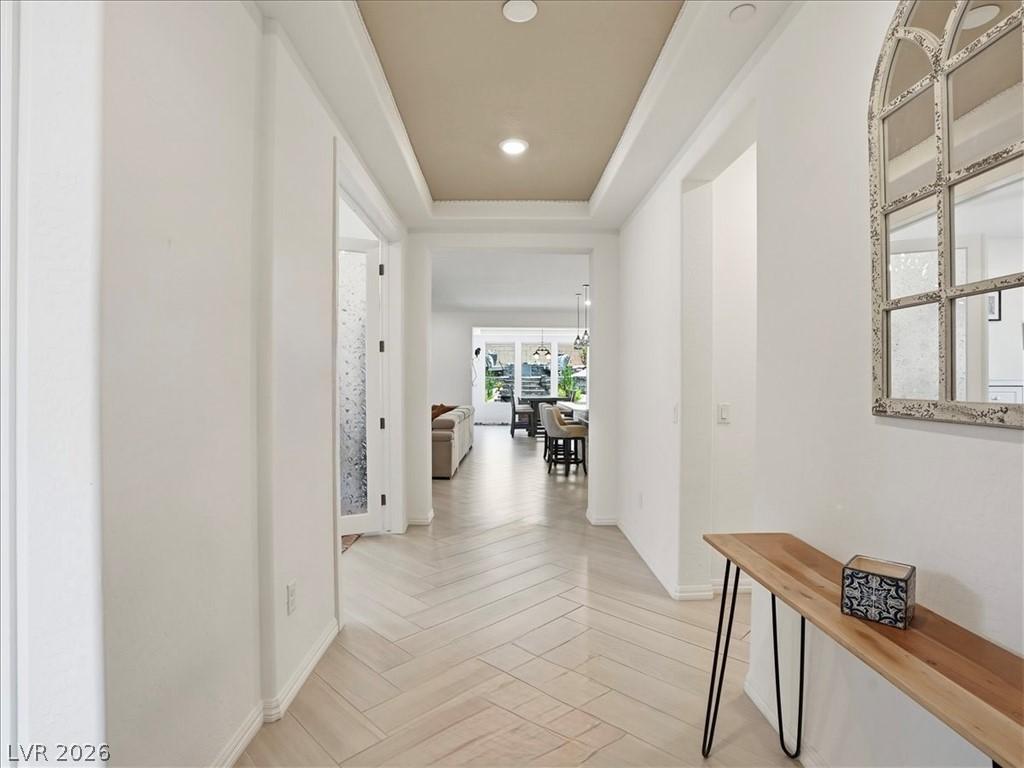 Image 4: Herringbone pattern wood flooring guides visitors