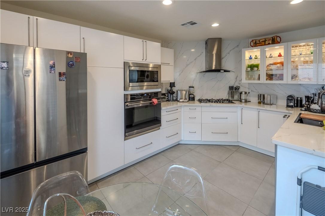 Image 3: Kitchen with appliances with stainless steel finis