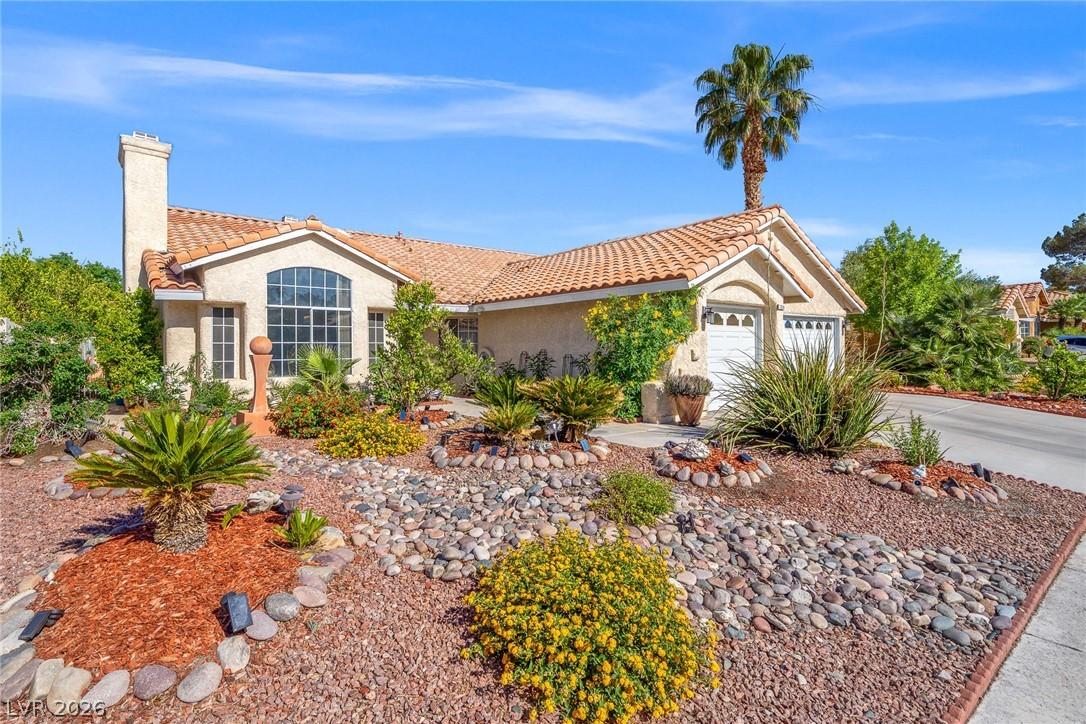 Image 2: This desert-landscaped residence features a welcom