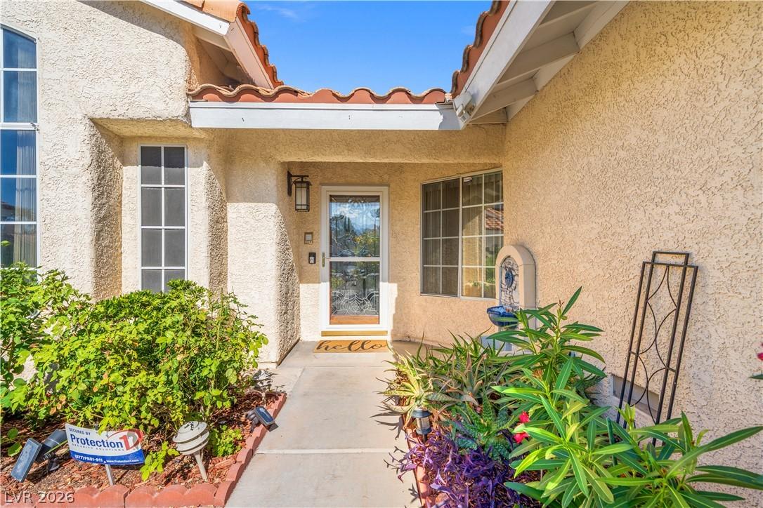 Image 3: The welcoming entrance of this home features a cha