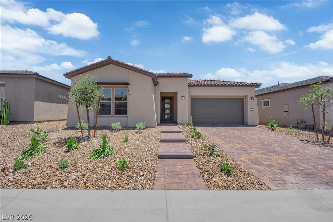 Image 1: A desert-inspired front yard offers low-maintenanc