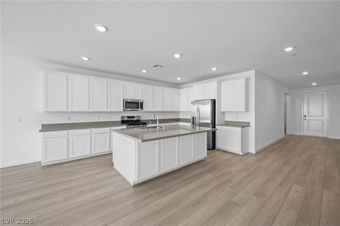 Image 4: A sleek, contemporary kitchen with abundant storag