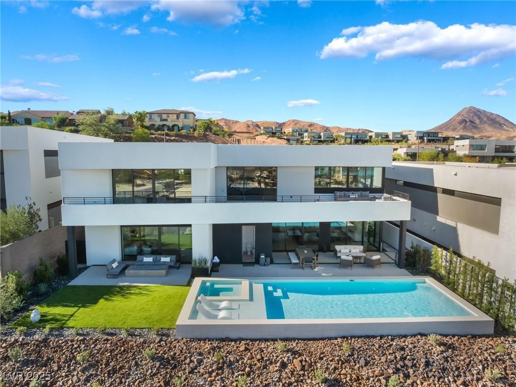 Image 3: Rear view of property featuring an outdoor living