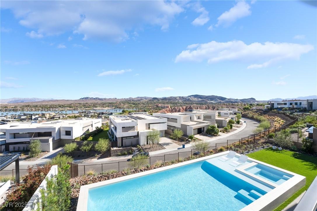 Image 4: View of swimming pool featuring a mountain view, a