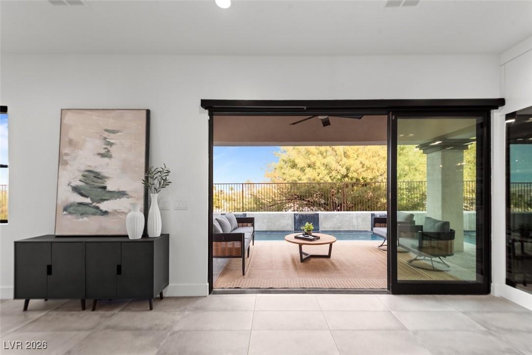Image 3: Doorway to outside featuring plenty of natural lig