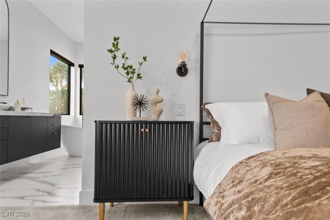 Image 4: Bedroom featuring light marble finish floors