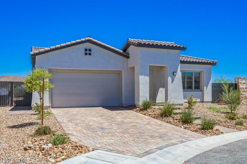 Image 1: A well-maintained paved driveway leads to this cha