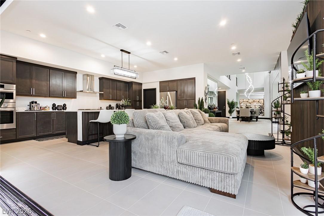 Image 3: Seamlessly blending kitchen and living areas, this