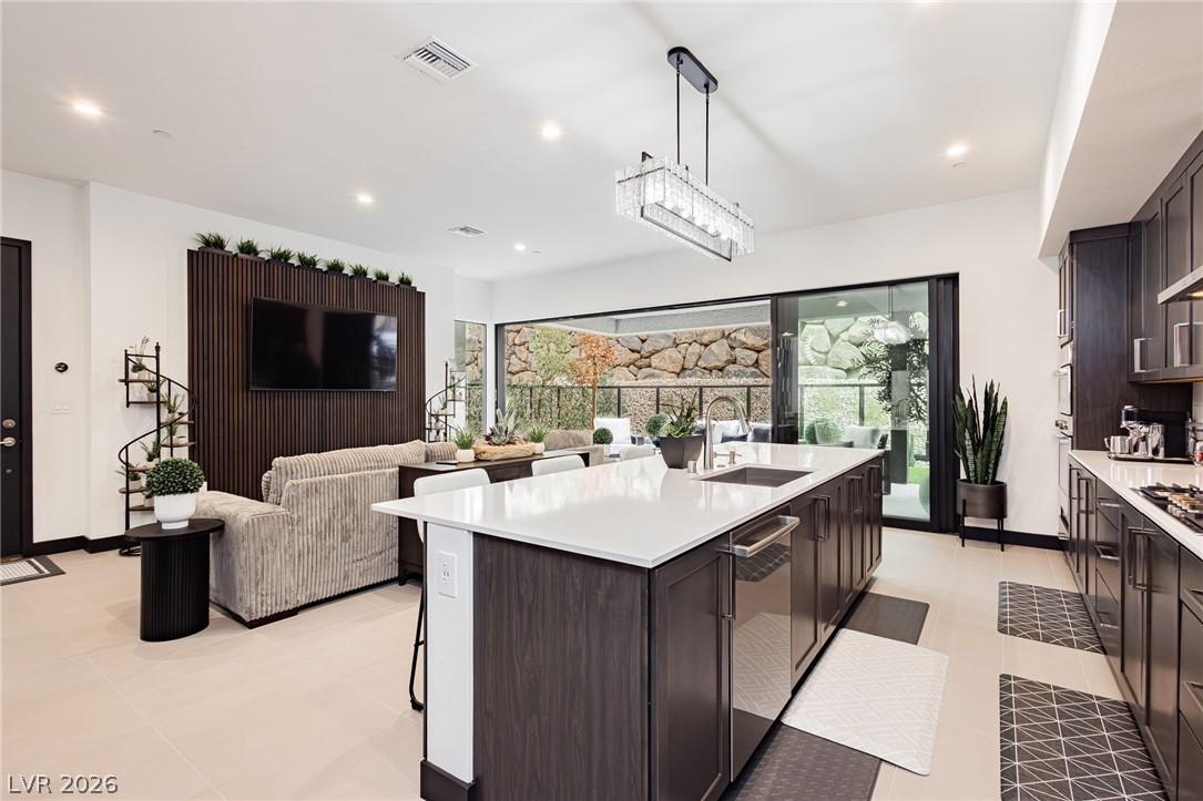 Image 4: An open-concept living space with a gourmet kitche