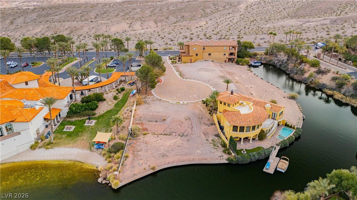Image 4: A striking property offers prime waterfront living
