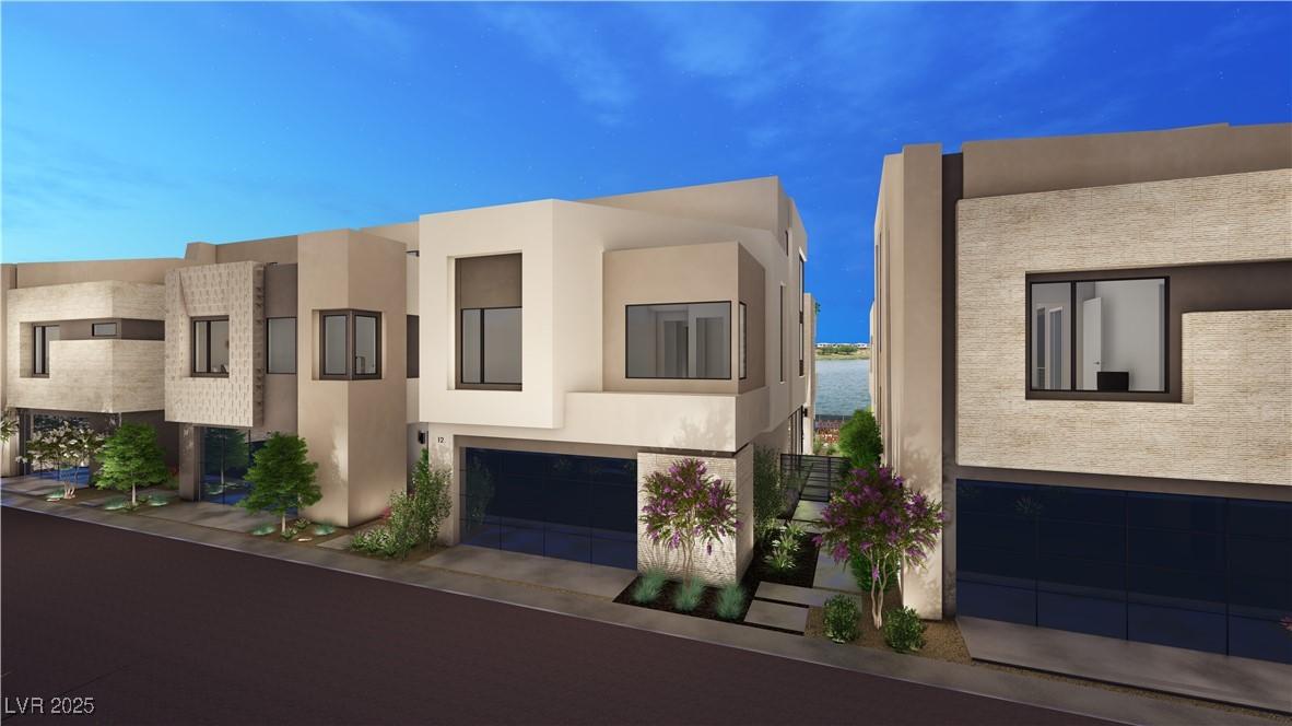 Image 1: View of front of property featuring stucco siding,