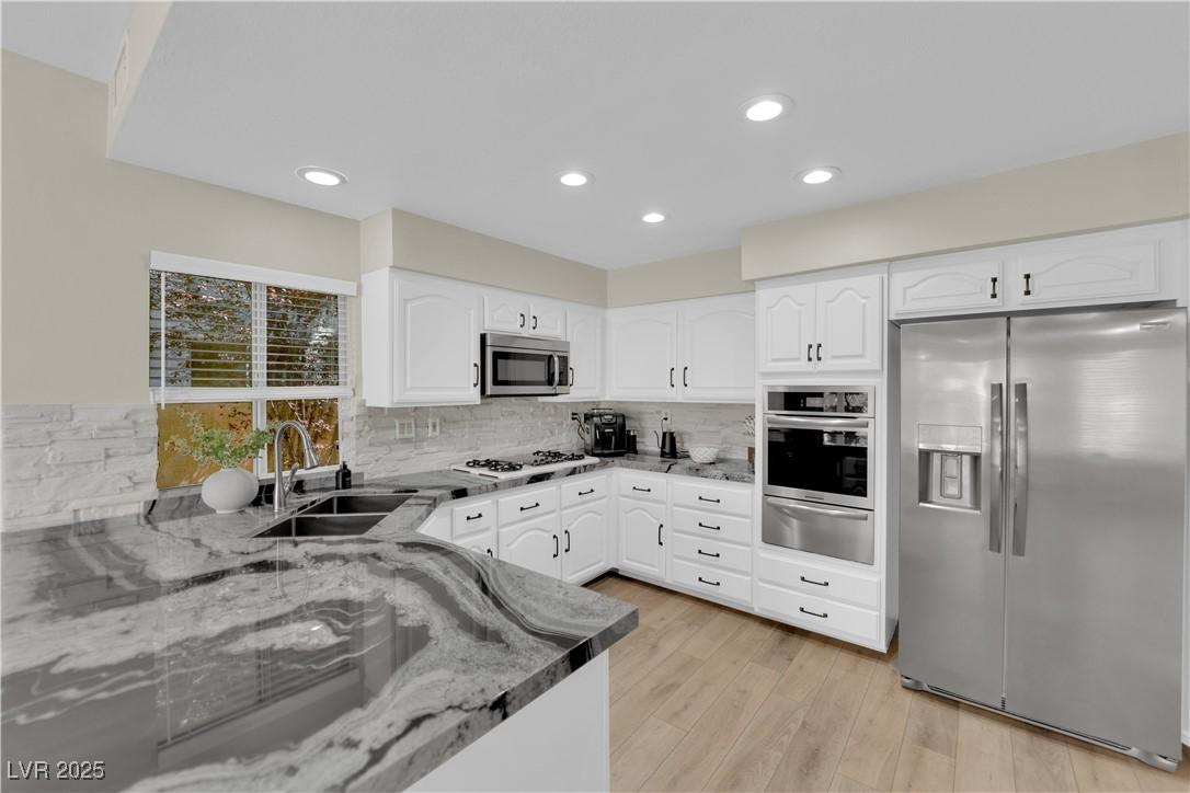 Image 2: Kitchen featuring appliances with stainless steel