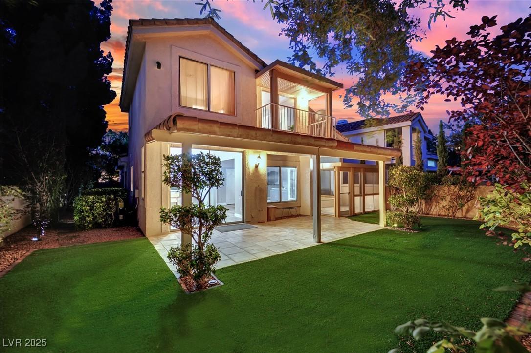Image 4: Rear view of house with a balcony, a patio, and st