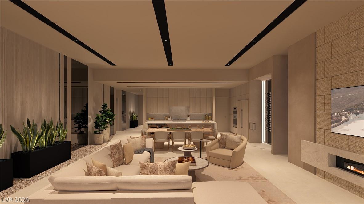 Image 4: An open concept living area boasts a modern firepl