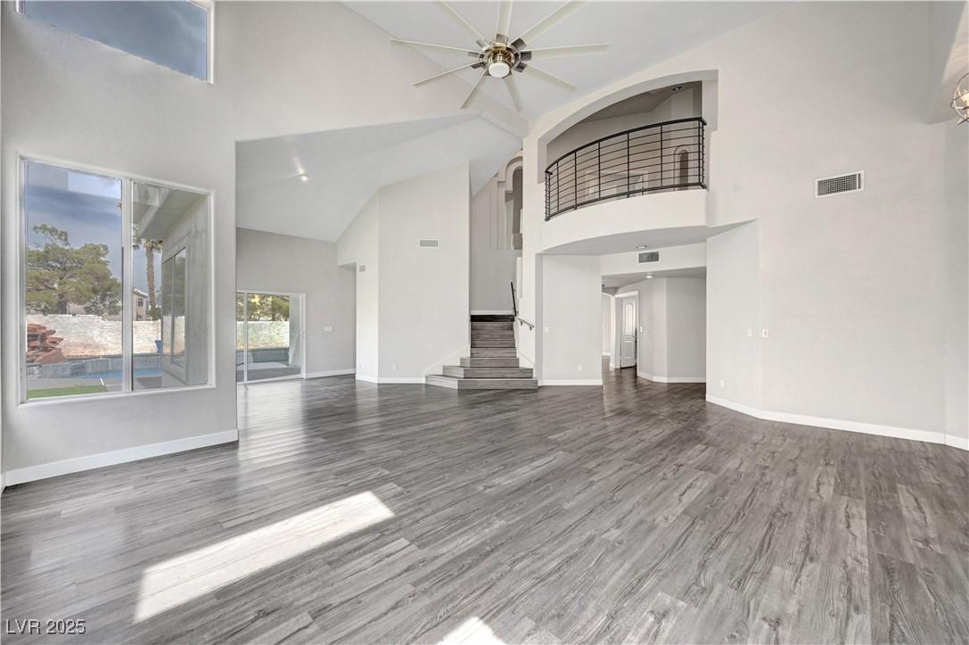 Image 4: Unfurnished living room featuring visible vents, w