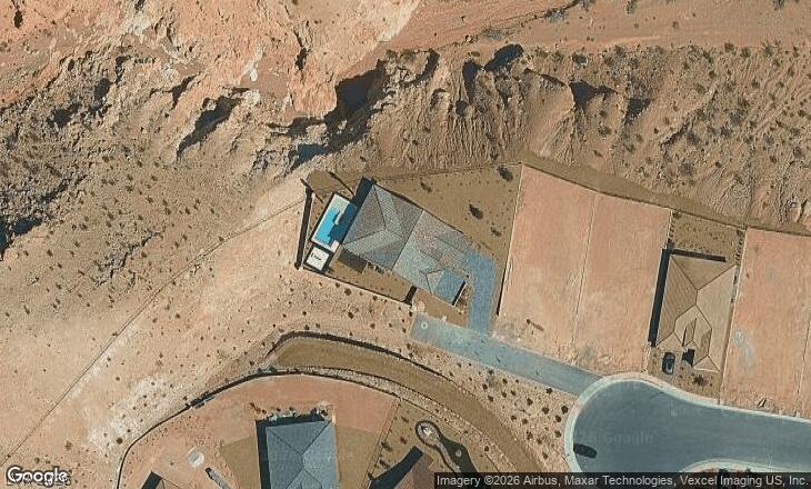 Image 1: An aerial perspective reveals a desert dwelling fe