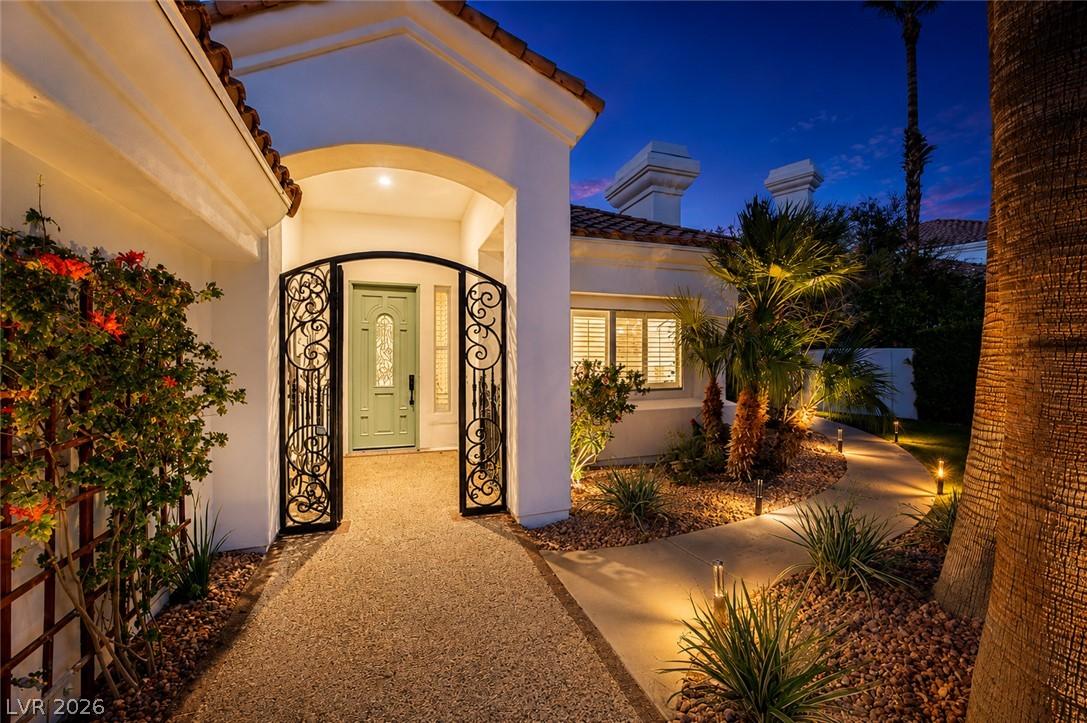 Image 4: Ornate wrought iron gates welcome visitors to this