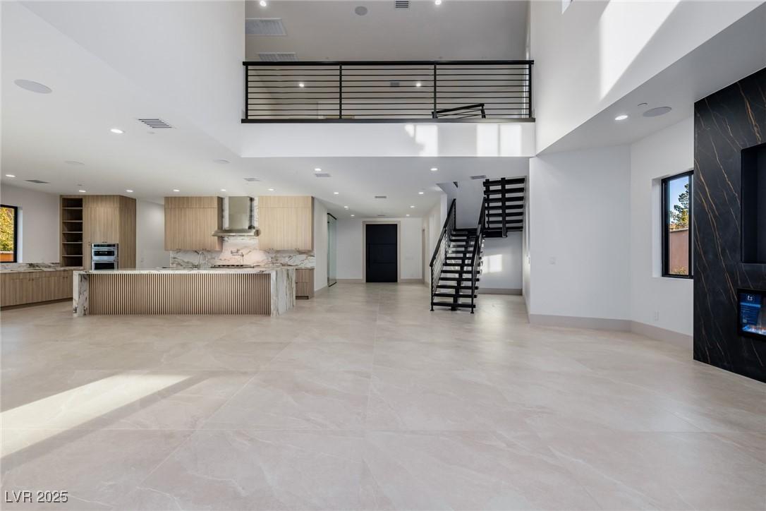 Image 1: Unfurnished living room with recessed lighting, vi