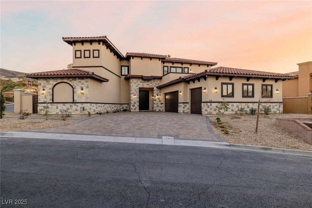 Image 2: Mediterranean / spanish-style home featuring stone