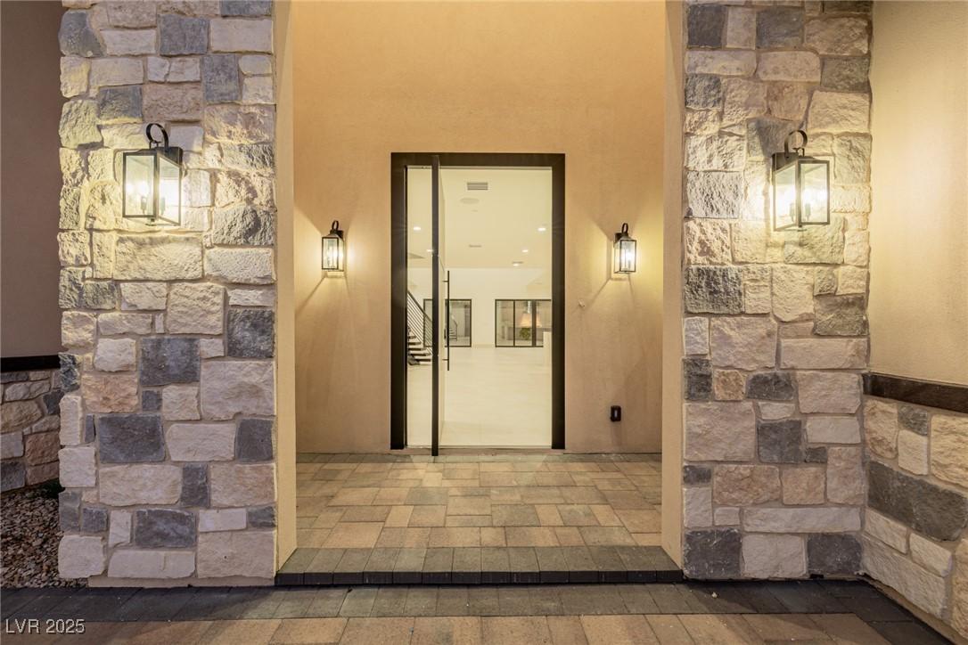 Image 4: Property entrance with stucco siding
