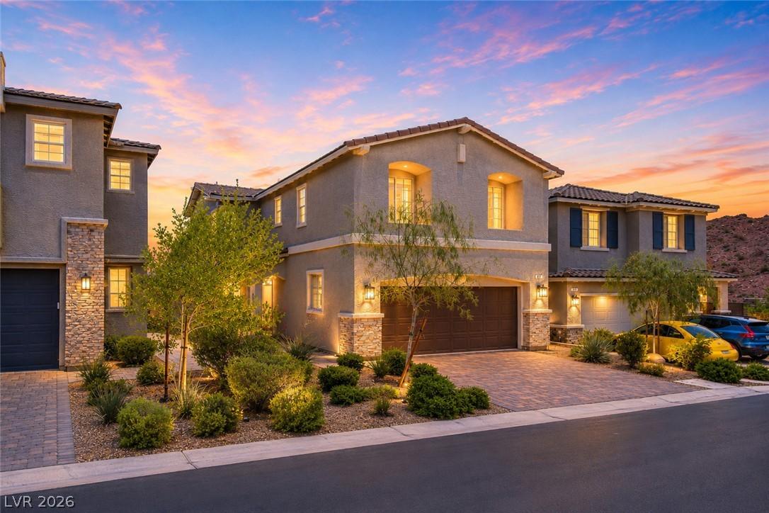 Image 1: Golden hour illuminates this charming desert resid