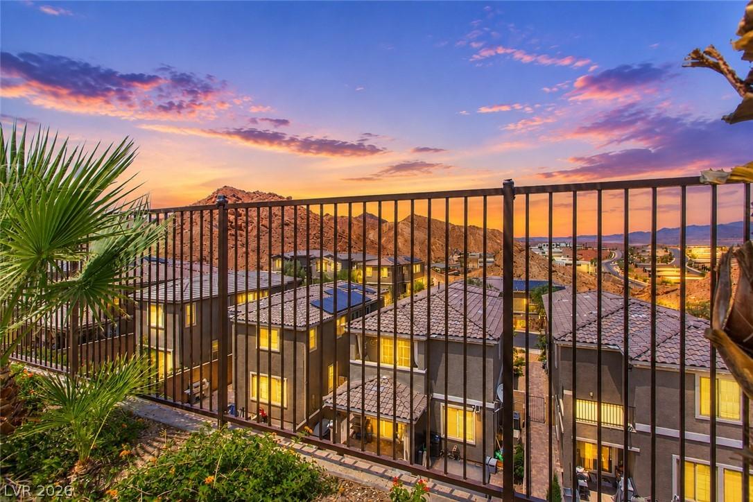 Image 2: Sunset views over rugged mountains frame this dese