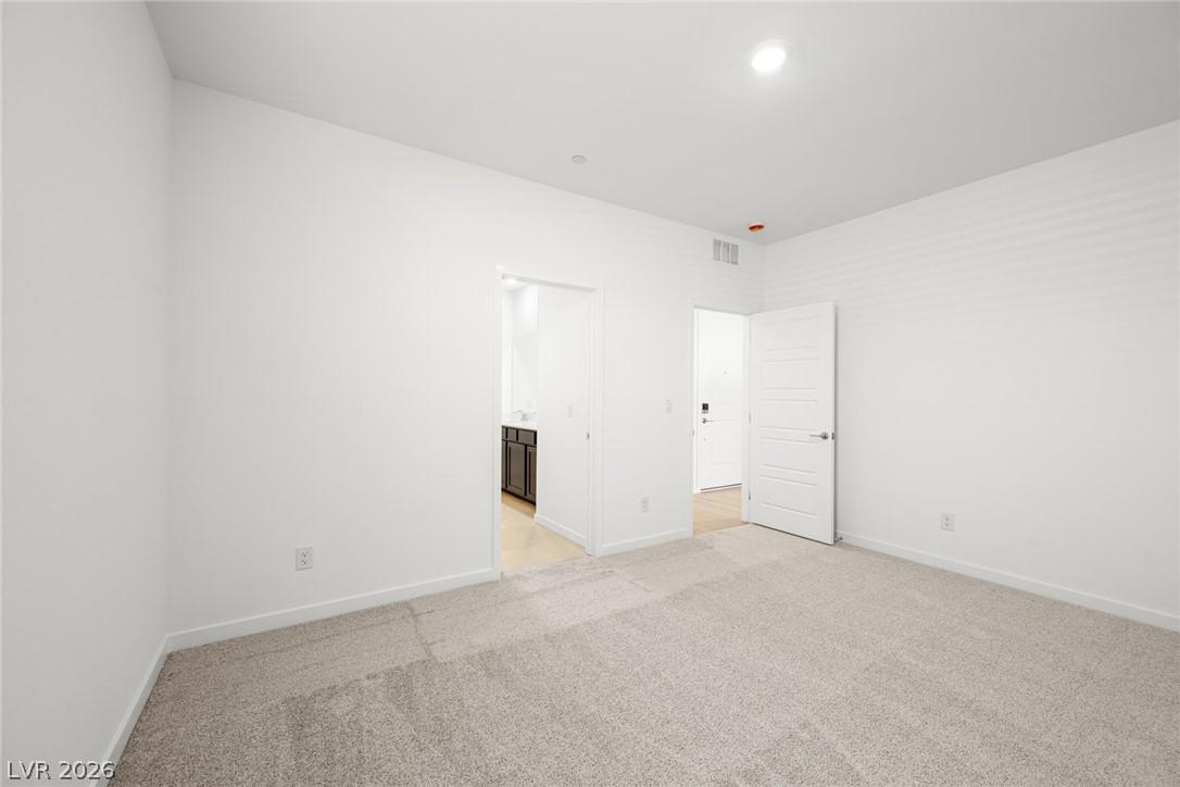 Image 4: A quiet, carpeted room offers versatile living spa