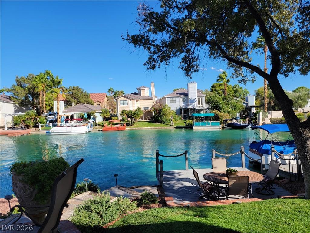 Image 2: A tranquil waterfront setting with a private dock
