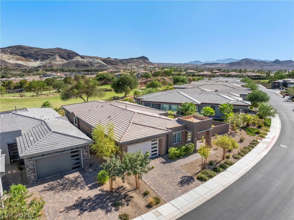 Image 1: An aerial perspective reveals a modern home nestle