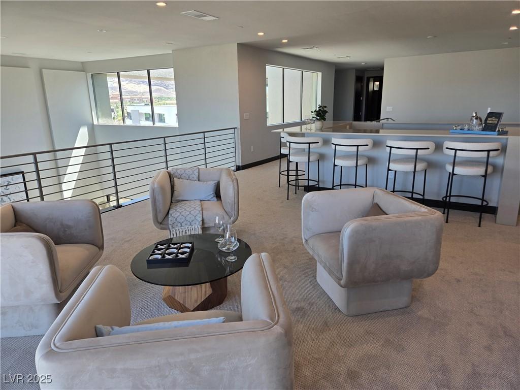 Image 4: Wet Bar on loft ready for entertaining. Exits onto
