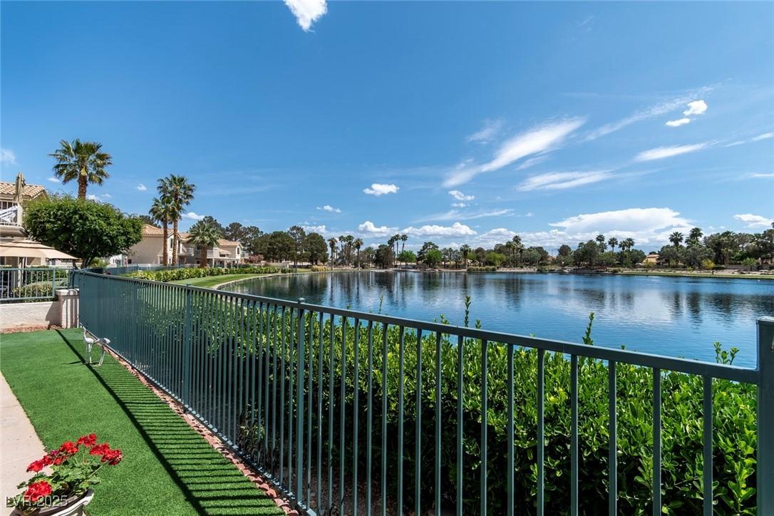 Image 3: Water view from patio with fence