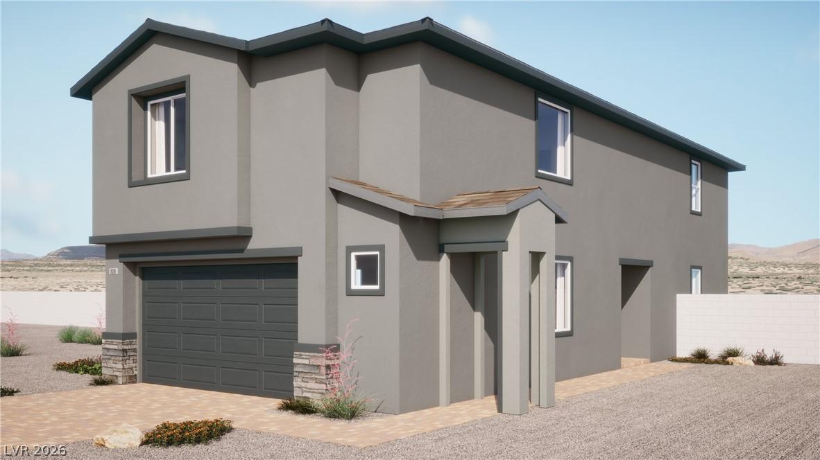 Image 1: A contemporary gray stucco exterior is accented by
