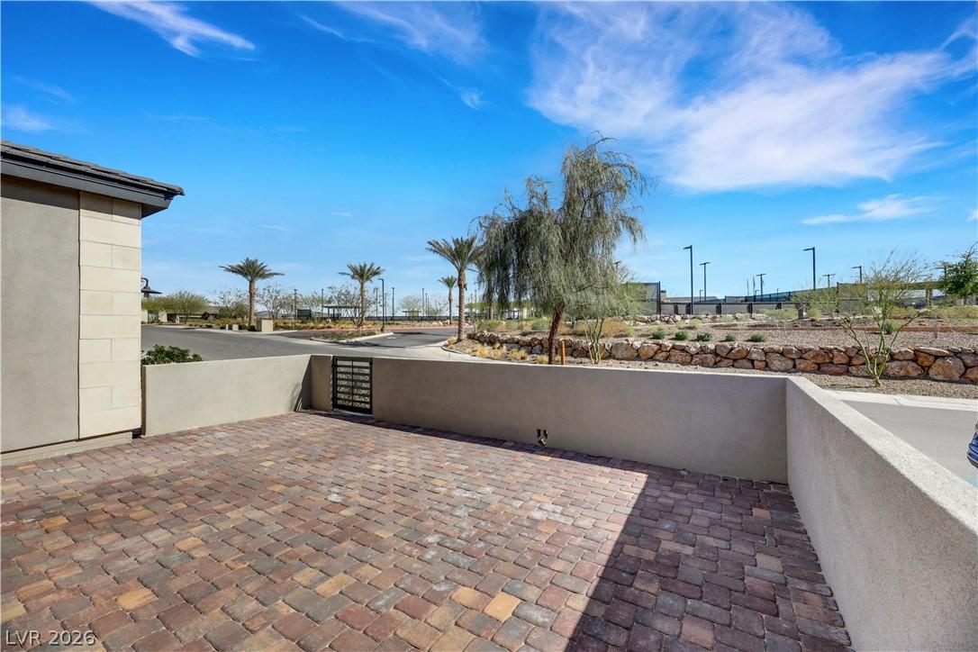 Image 4: A private paver patio area with a charming small g