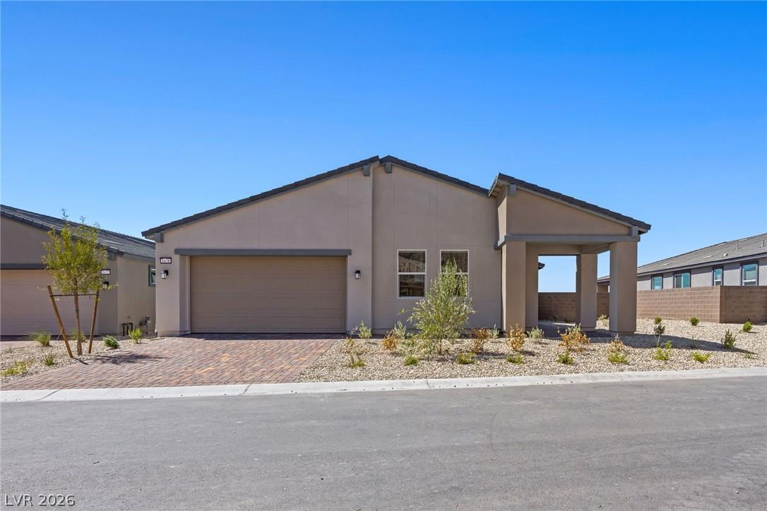 Image 1: A newly constructed modern home showcases desert l