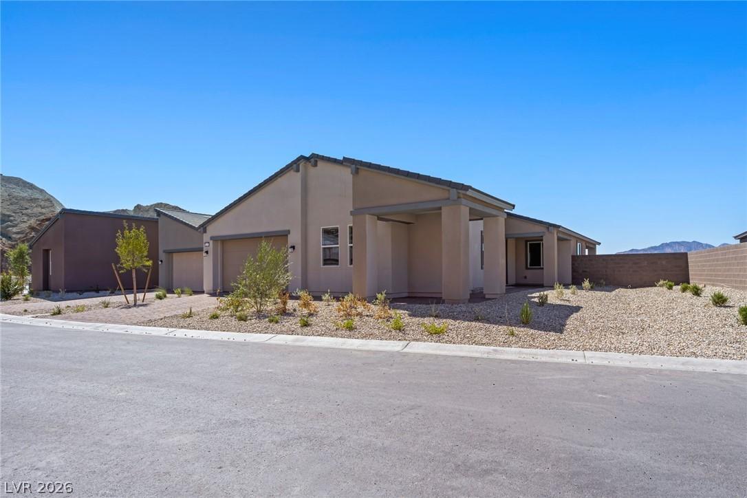 Image 2: A desert-friendly landscape accents the neutral-to