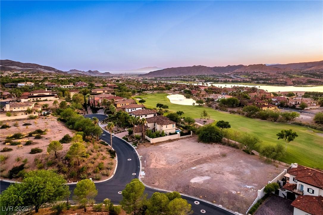 Image 1: Aerial view at dusk of a mountain view, golf cours