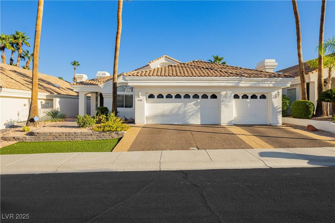Image 2: View of front of house featuring stucco siding, dr
