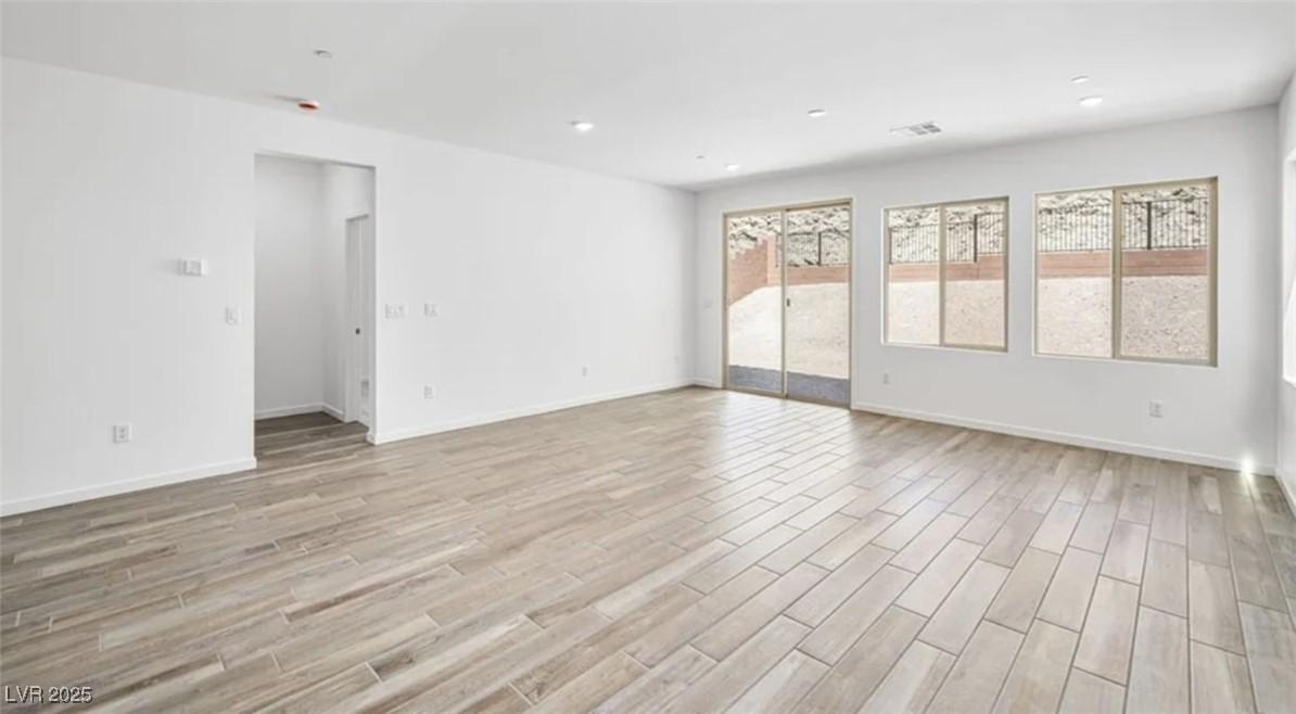 Image 3: Spare room featuring light wood-style flooring and