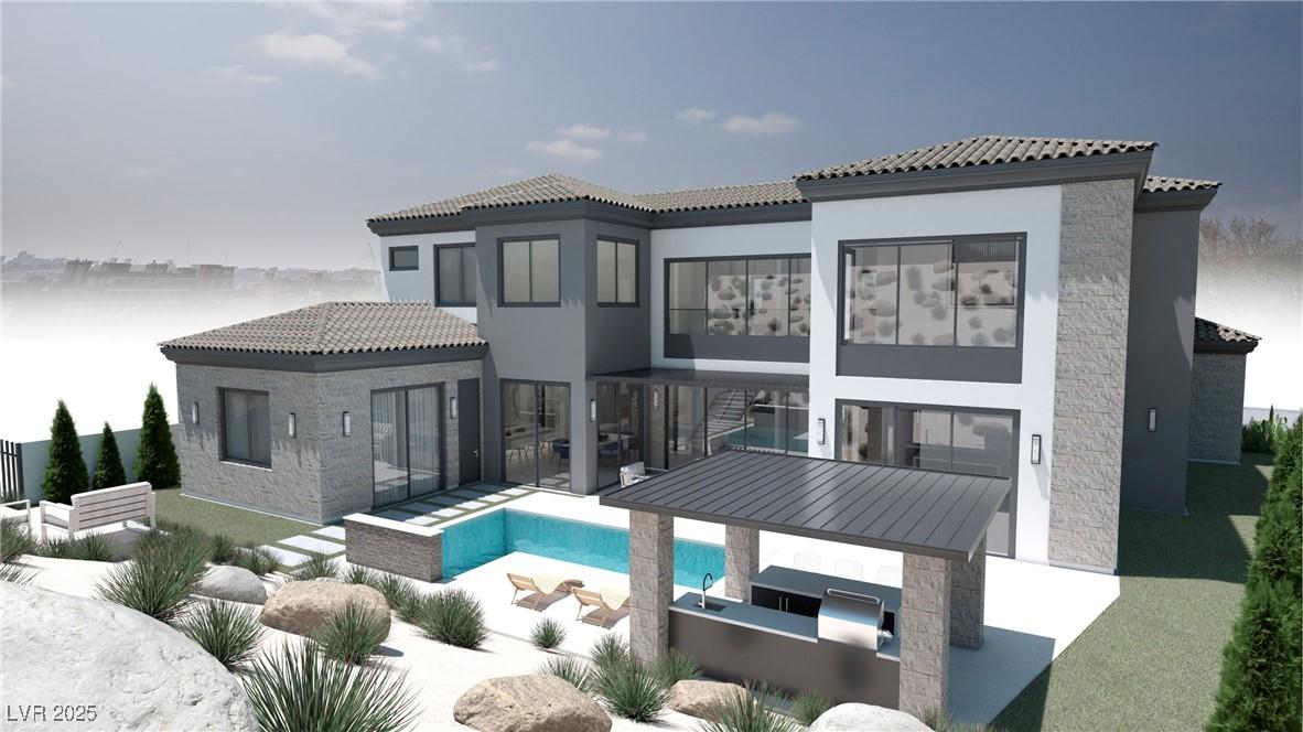 Image 3: Back of property with a tile roof, a patio, stucco