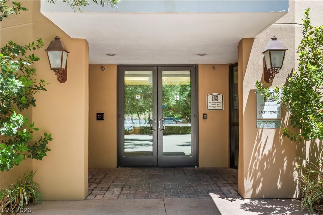 Image 4: The welcoming entrance features sturdy glass doors
