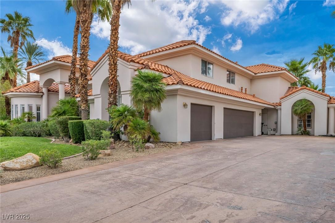 Image 3: Mediterranean / spanish-style home with driveway,