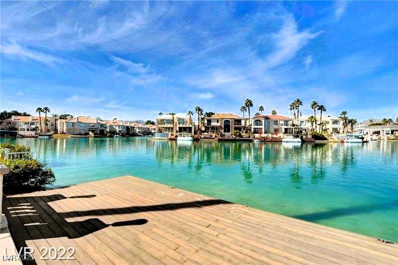 Image 3: Dock with a residential view and a water view