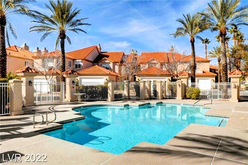 Image 4: Community pool featuring a patio area and a reside